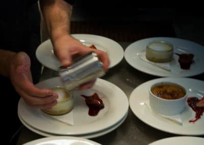 Commercial photography for restaurant of desserts being prepared in kitchen