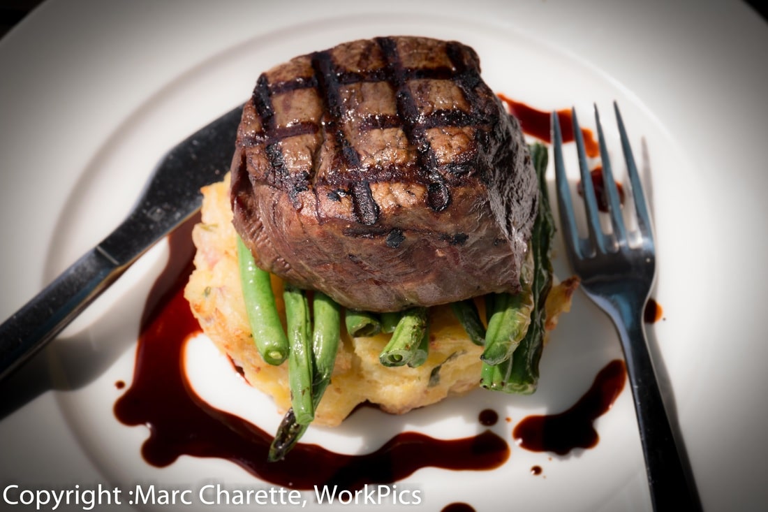 Commercial photography for restaurant of plated steak meak