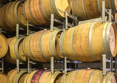 Commercial photography of winery with barrels of wine